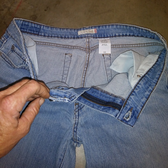 jeans with tag on zipper